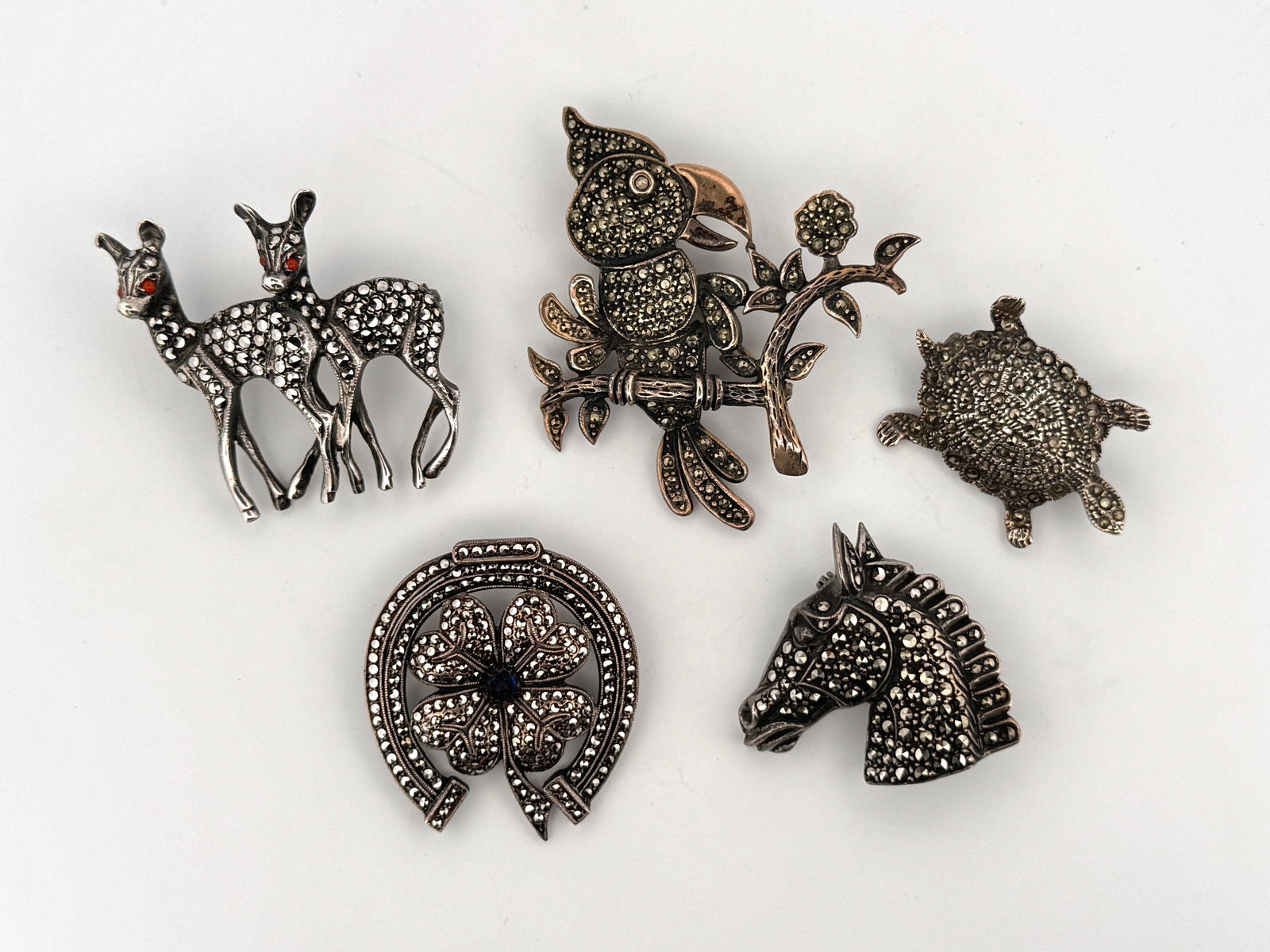 Five Silver Marcasite Brooches: Five sterling silver animal-shaped brooches with marcasite stones.Total Weight: 46.8 gLongest Length: 2"