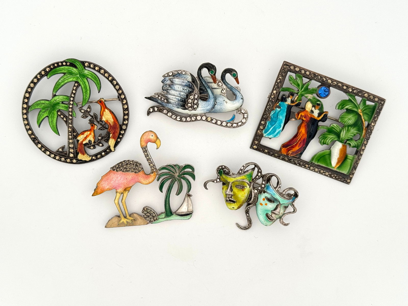 Five Silver, Enamel & Marcasite Brooches: Five sterling silver and enamel brooches with marcasite stones. Two are Uncas brooches, marked on reverse, and one is signed HK.60glargest 1.75"