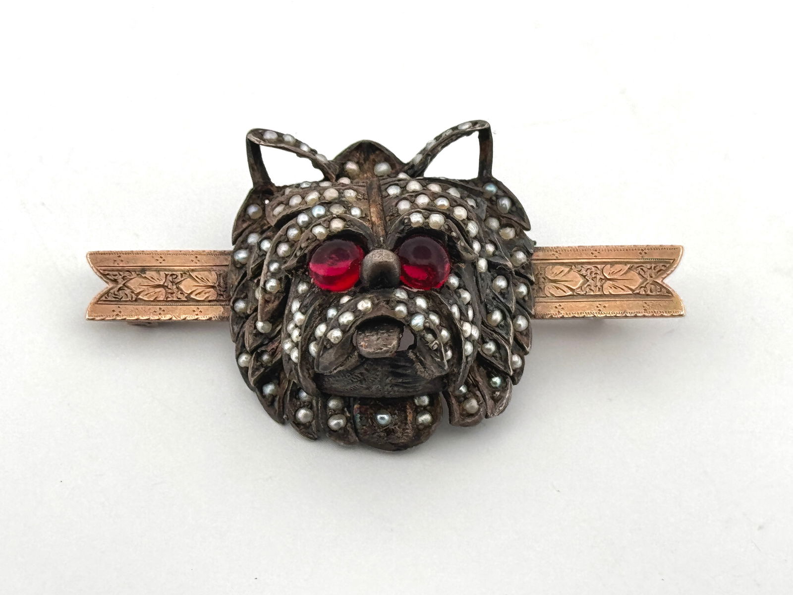 Seed Pearl Dog Face Brooch: Silver and gold filled with seed pearls, glass eyes, and articulated tongue.14.9g2"