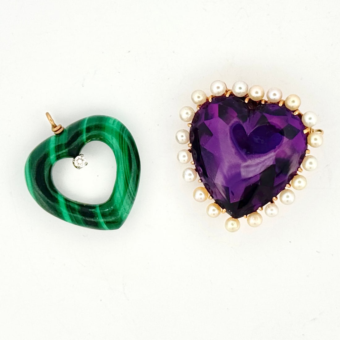 14k Gold Malachite & Amethyst Heart Pendants: A group of two heart-shaped pendants, including a malachite pendant with a 14k gold loop and a diamond, and a gold and amethyst pendant with pearls.12.6glarger 1"