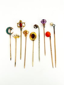 Nine Gold Stick Pins