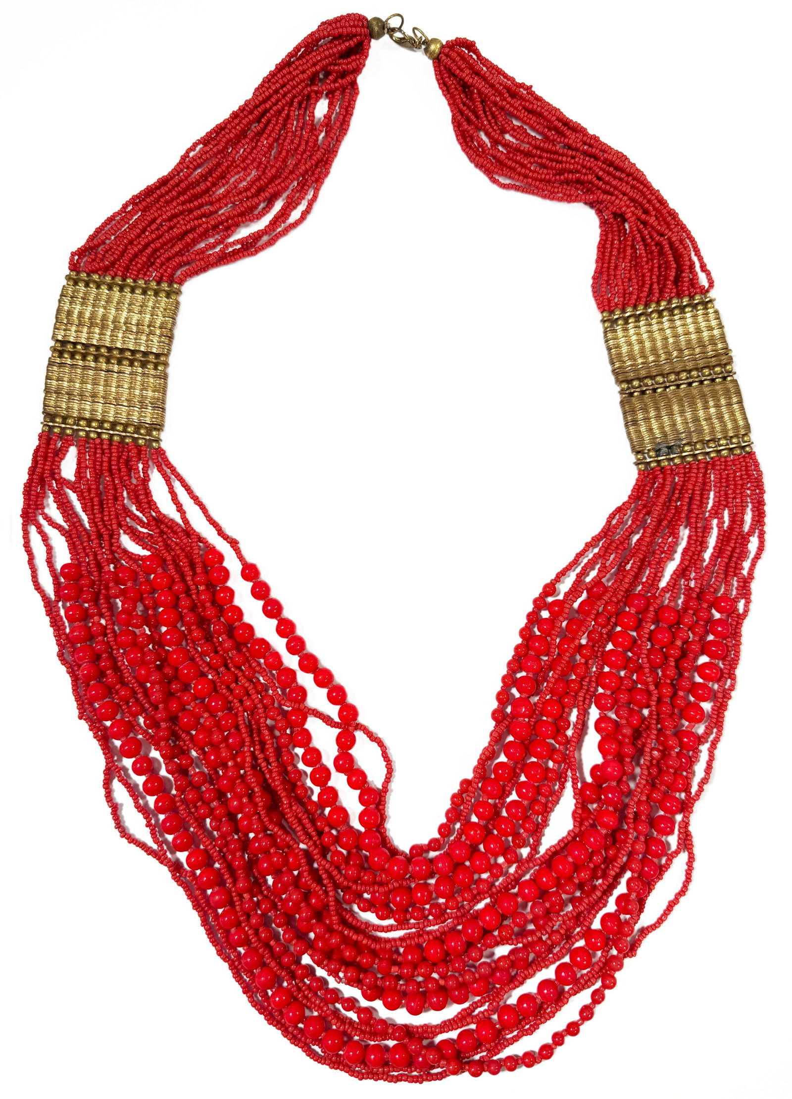 Red Beaded Multi-Strand Necklace: Multi-strand red beaded necklace featuring gold-tone metal accents. Length : 17 1/2"Total Weight: 368 g