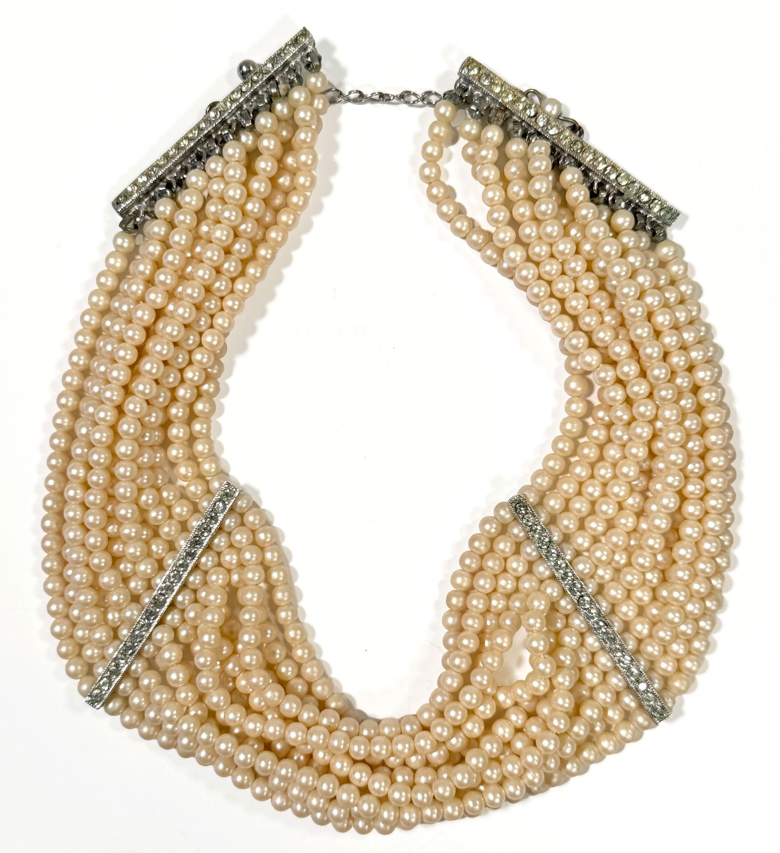 Multi-Strand Faux Pearl Necklace with Rhinestone Accents: Multi-strand necklace with faux pearls and rhinestone bars at intervals.Length : 11 1/2"Total Weight: 48 g