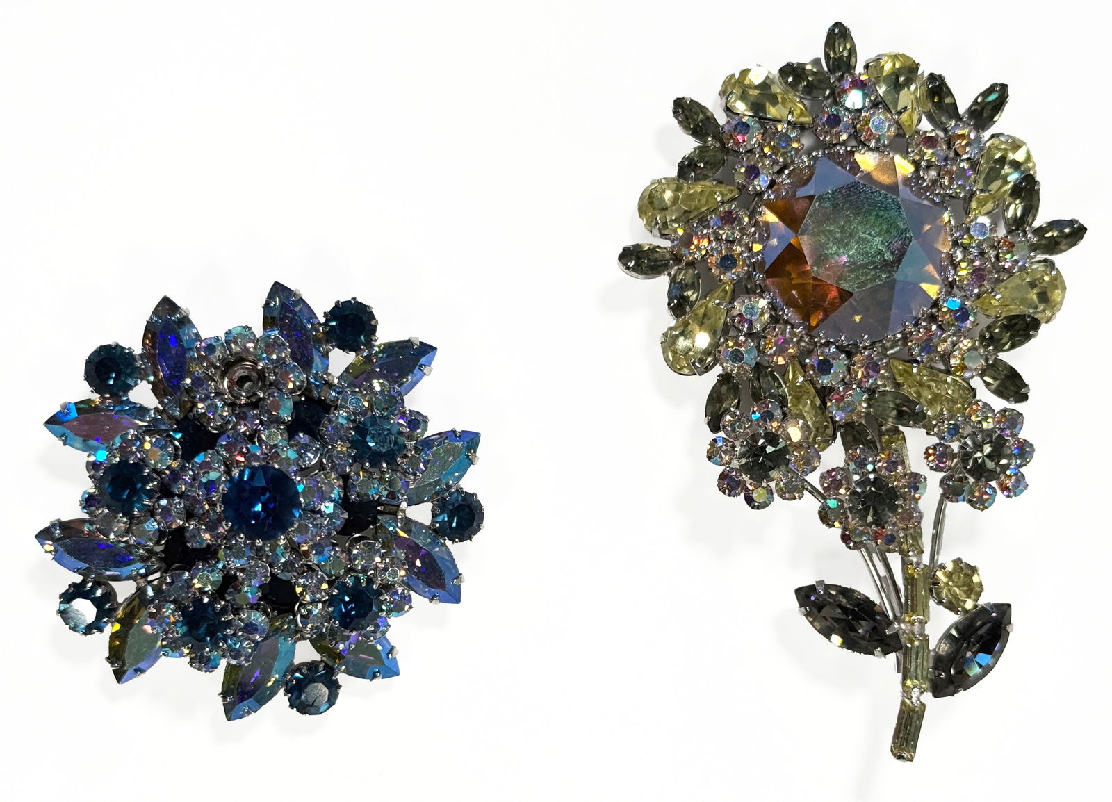 Two Vendome Rhinestone Brooches: Set of two floral rhinestone Vendome brooches. Both complete with original metal tags and marked Vendome on reverse.Width : 2 1/4"Length : 3 1/4"75.7g