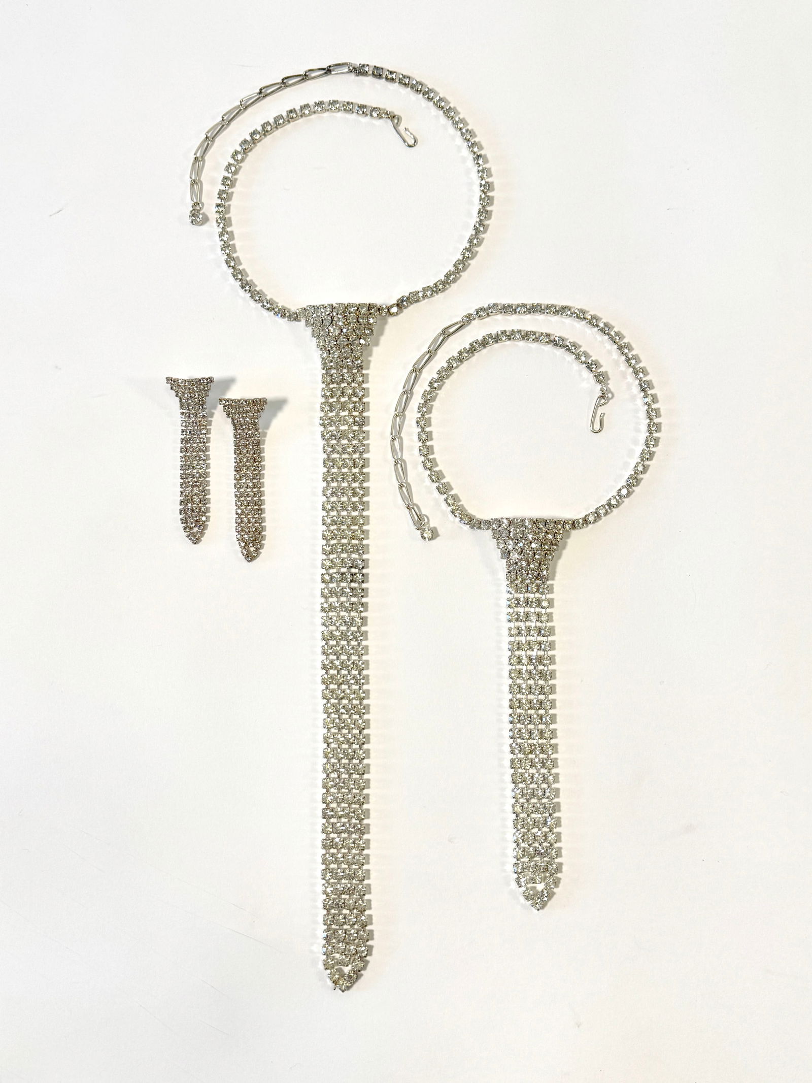 Rhinestone Mesh Necklace, Bracelet & Earrings Set: Rhinestone mesh jewelry set including a necklace, bracelet, and earrings. The necklace is the longest piece, measuring approximately 18.5 inches. The set weighs 119.1g.