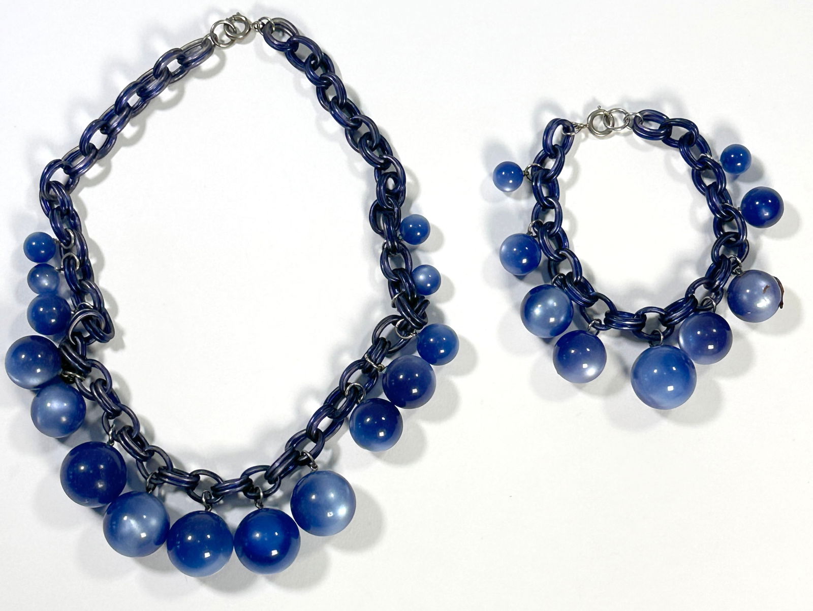 Blue Acrylic Necklace and Bracelet Set: A blue acrylic bead necklace and bracelet set. The necklace is approximately 8.25 inches in length.81.4g