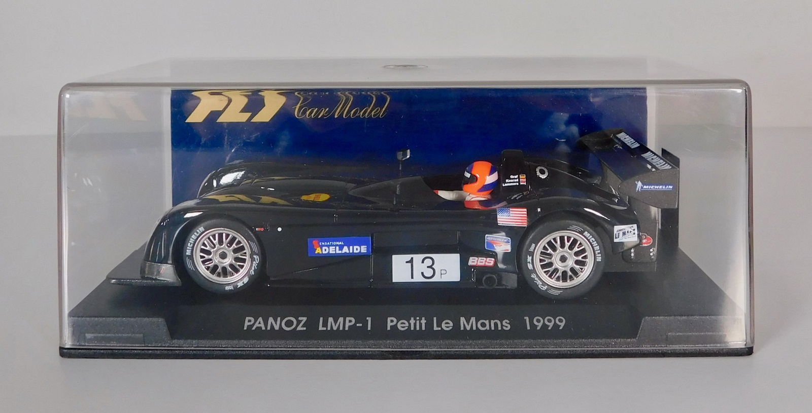 Fly Car Model Panoz LMP-1 Petit Le Mans 1999 #13: FLY Car Model Panoz LMP-1 Petit Le Mans 1999 #13 Michelin 1/32 Slot Car. Reference #A92, with original case. Dimensions 2.75'' x 6.5''. Weighs 7oz.