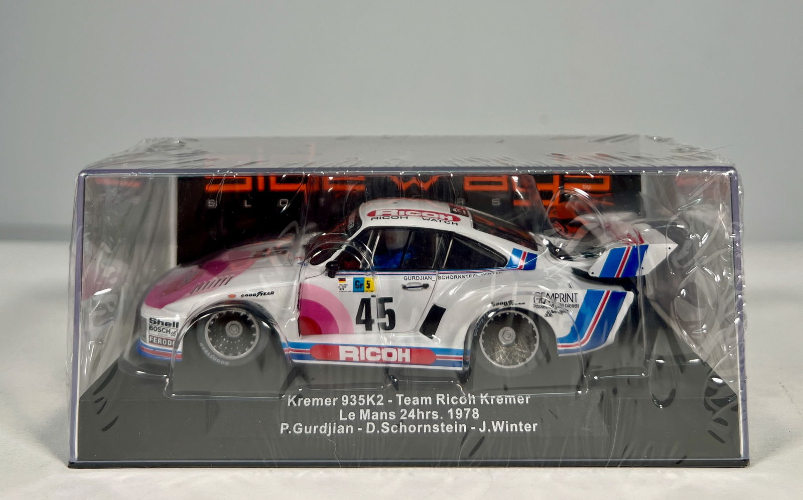 Sideways Kremer 935K2 #45 Le Mans 24h. 1978: Kremer 935K2 Team Ricoh Kremer Le Mans 24h. 1978 Gurdjian - Schornstein - Winter #45 1/32 Slot Car. Reference #SW45. Chassis/motor ref. SW33, with original case. Weight: 6oz. Shrink-wrapped.