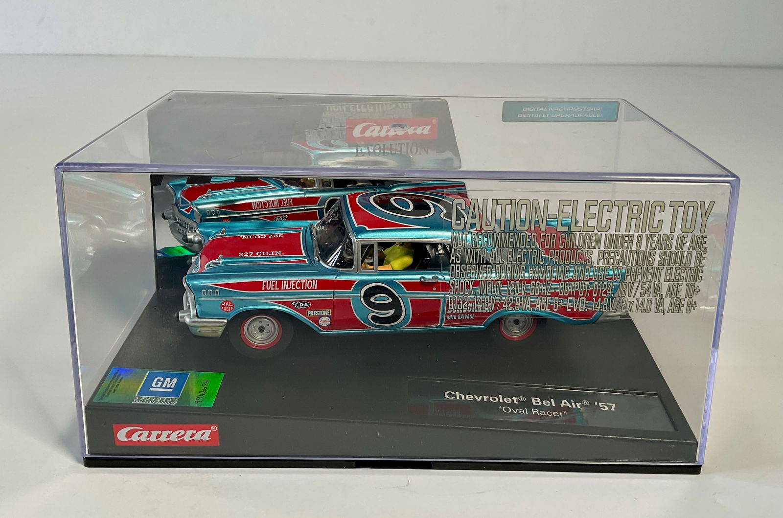 Carrera Evolution Chevrolet Bel Air '57 Oval Racer #9: Carrera Evolution Chevrolet Bel Air '57 "Dual Racer" slot car in display case. Reference #99A1674, with original case. Box measures 4.25'' tall. Weight: 16.5 oz.
