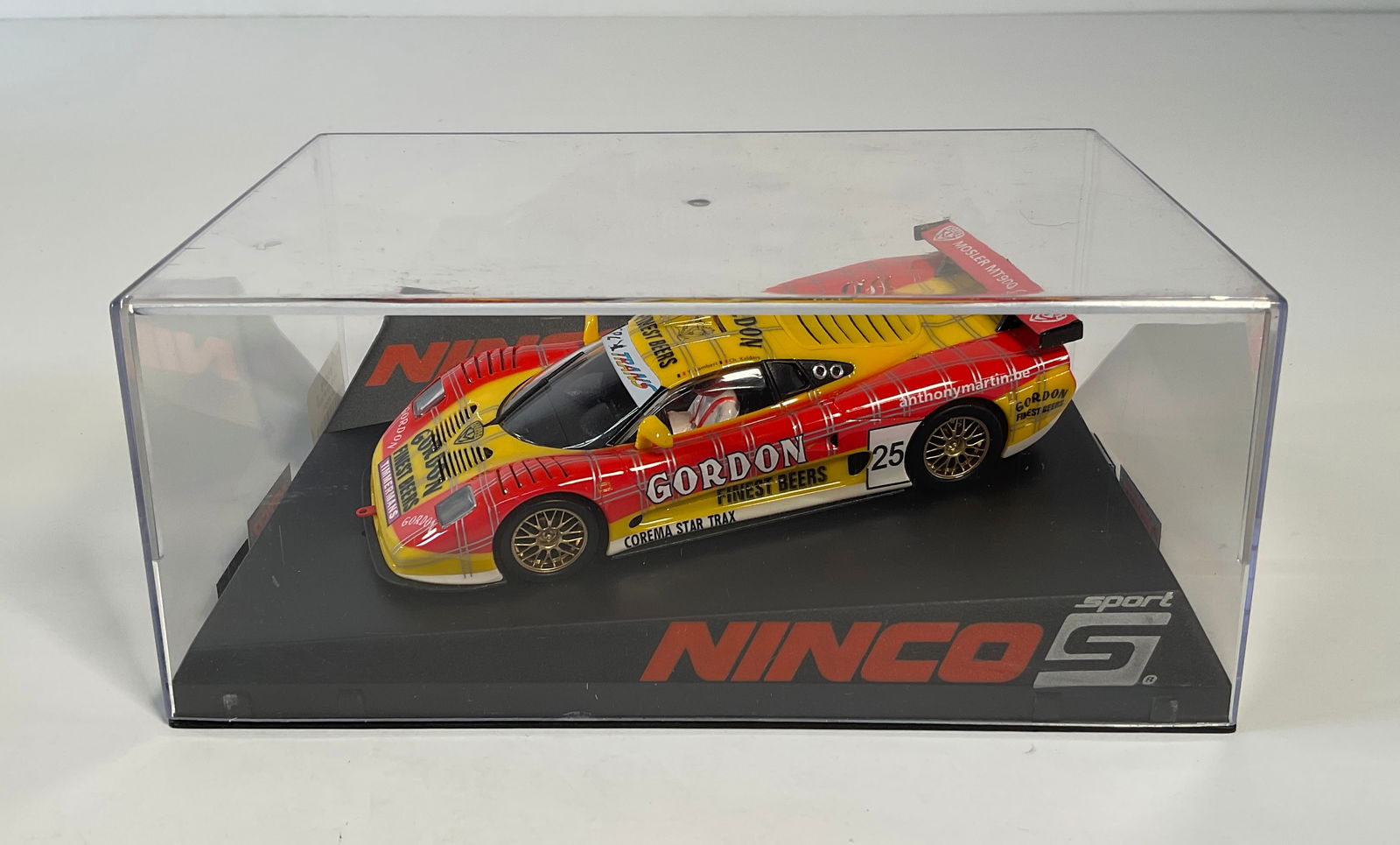 Ninco Mosler MT900R #25: Ninco Mosler MT900R Gordon #25 Finest Beers 1/32 Slot Car. Reference #50576. Box measures 3.5 x 8 inches. Weight 9.3 oz.
