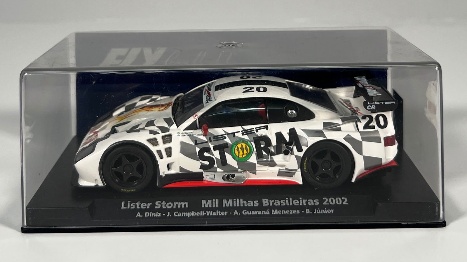 Fly Car Model Lister Storm Mil Milhas Brasileiras 2002 #20: Fly Car Model Lister Storm Mil Milhas Brasileiras 2002 Diniz - Walter - Menezes - Junior #20 Capuava Racing Team 1/32 Slot Car A-404. Reference #88207, with original case. Weight: 7 oz.