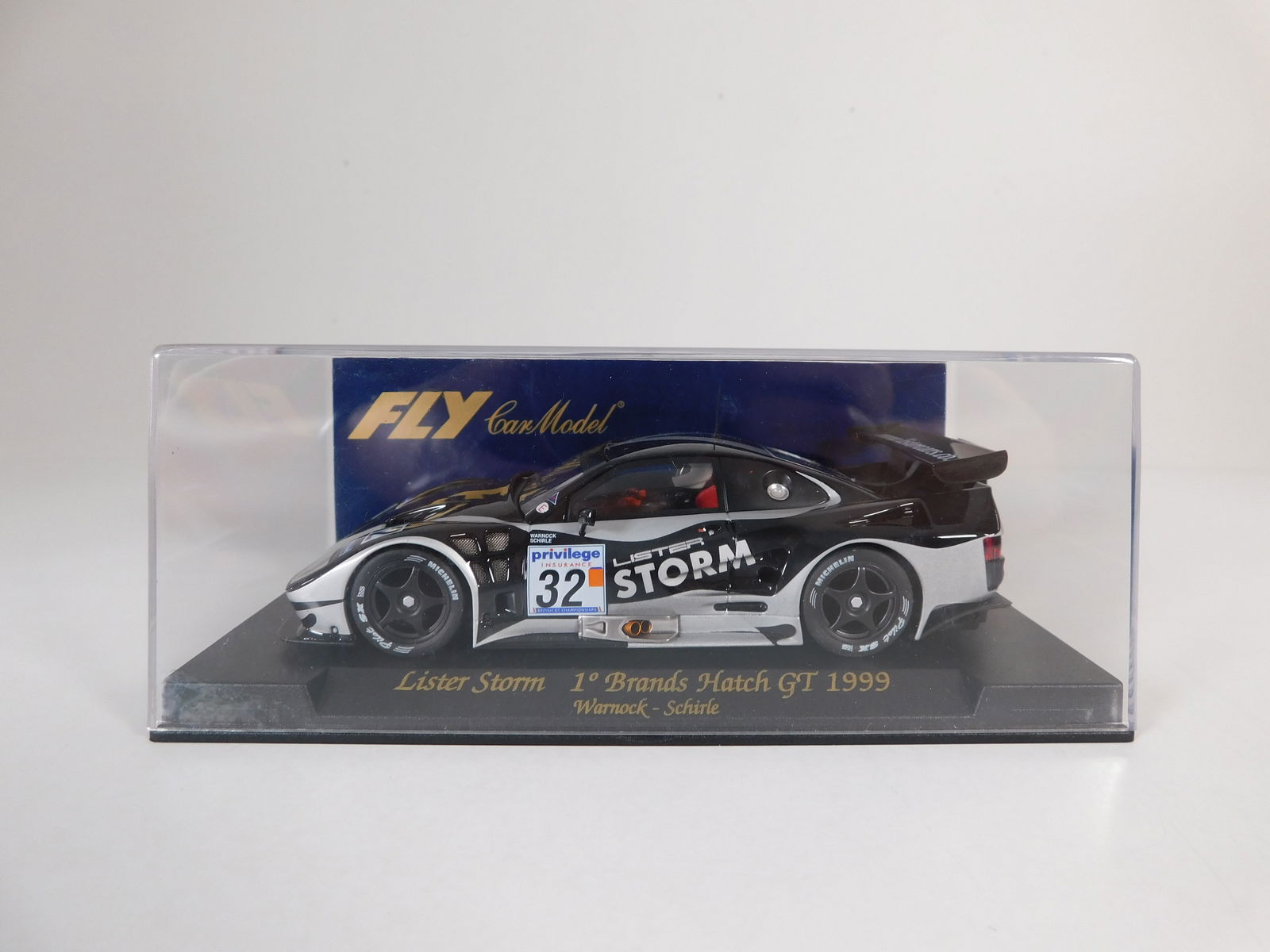 Fly Car Model Lister Storm 1st Brands Hatch GT 1999 #32: Fly Car Model Lister Storm 1st Brands Hatch GT 1999 Warnock - Schirle #32 1/32 Slot Car. Reference #A105, with original case. Weight: 7oz. 