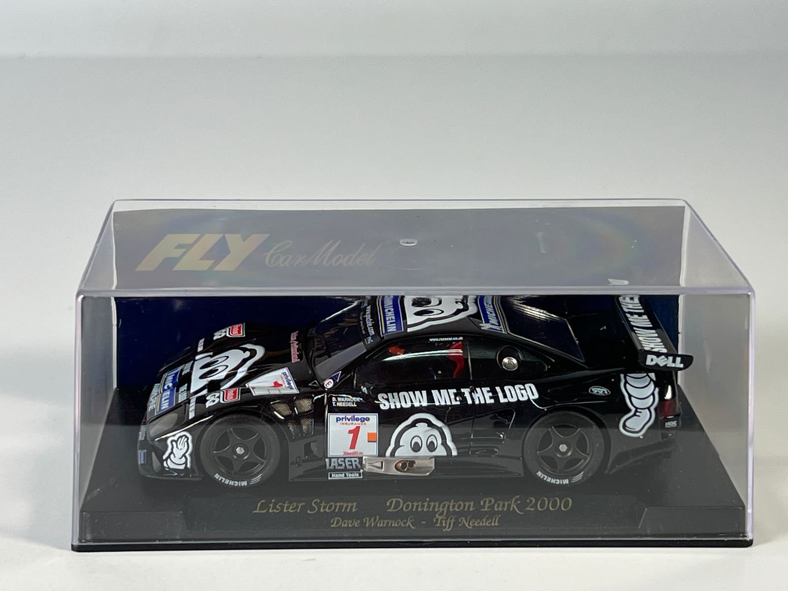 Fly Car Model Lister Storm Donington Park 2000 #1: Fly Car Model Lister Storm Donington Park 2000 Warnock - Needell #1 Michelin 1/32 Slot Car. Reference #A107, with original case. Weight: 6.8 oz.