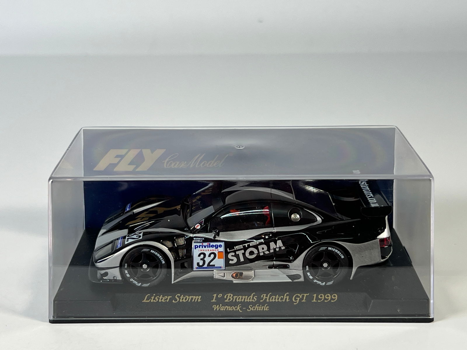 Fly Car Model Lister Storm 1st Brands Hatch GT 1999 #32: Fly Car Model Lister Storm 1st Brands Hatch GT 1999 Warnock - Schirle #32 Michelin 1/32 Slot Car. Reference #A105, with original case. Weight: 6.9 oz.