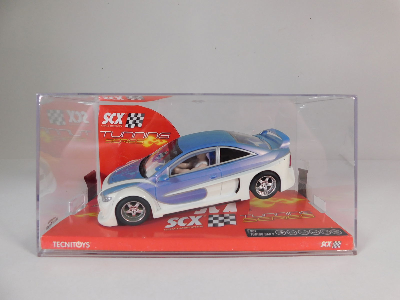 SCX Tuning Car 2: SCX Tuning Car 2 1/32 Slot Car. Reference #61980, with original case. Weight: 8.2 oz.