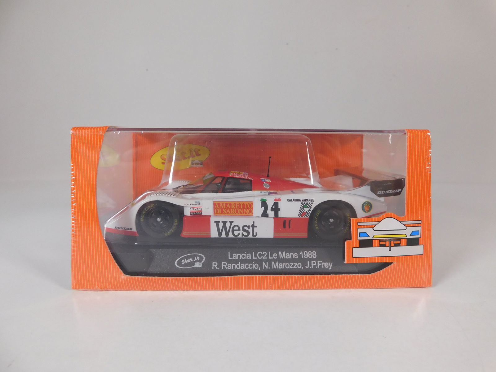 Slot.it Lancia LC2 Le Mans 1988 #24: Slot.it Lancia LC2 Le Mans 1988 R.Randaccio - N.Marozzo - J.P.Frey #24 West 1/32 Slot Car. Reference #CA21a, with original case. Weight: 7.1 oz. Shrink-wrapped - new in box.