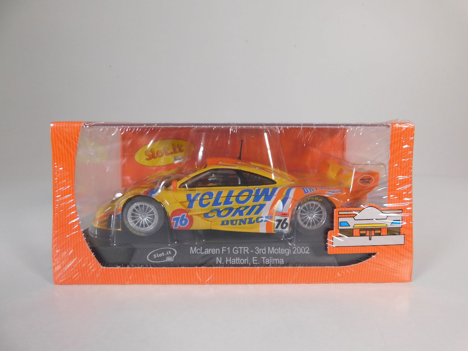 Slot.it McLaren F1 GTR - 3rd Motegi 2002 #76: Slot.it McLaren F1 GTR - 3rd Motegi 2002 Hattori - Tajima #76 Yellow Corn 1/32 Slot Car. Reference #CA10g, with original case. Weight: 7.5 oz. Shrink-wrapped, new in box.
