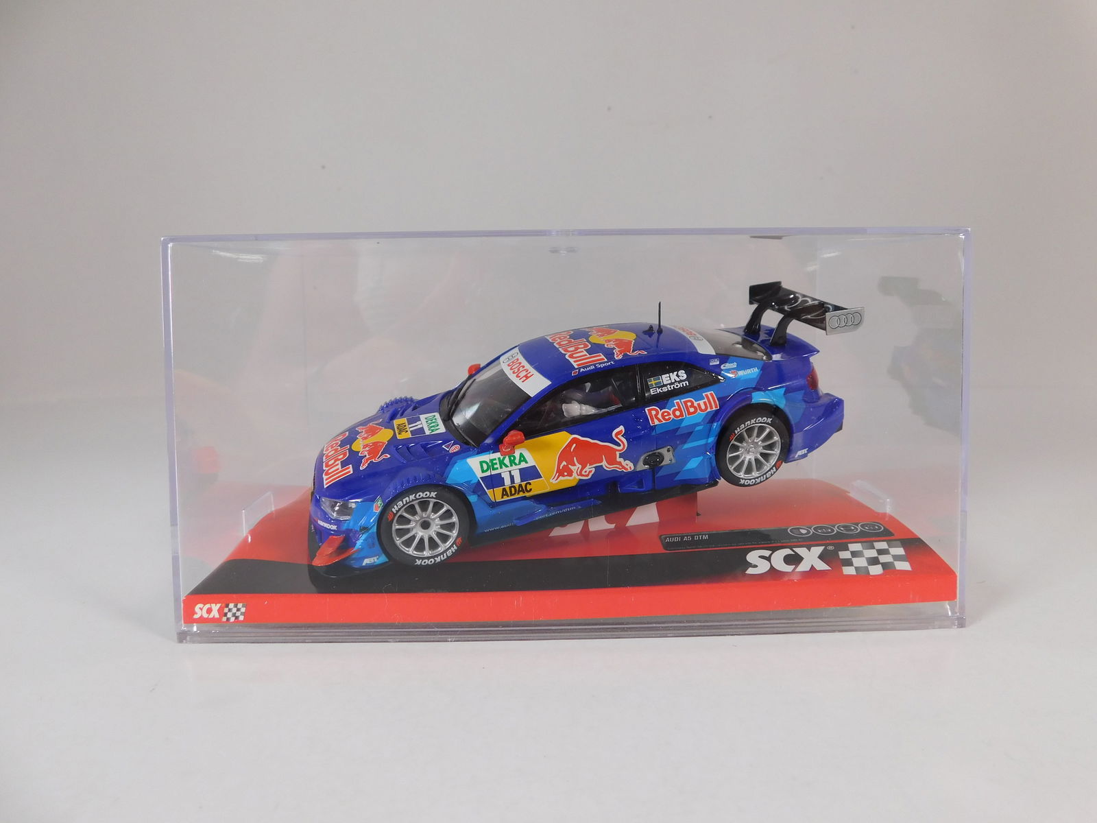 SCX Audi A5 DTM 'EkstrÃ¶m' #11: SCX Audi A5 DTM 'Ekström' #11 Redbull 1/32 Slot Car. Reference #A10136X300, with original case. Weight: 8.4 oz.
