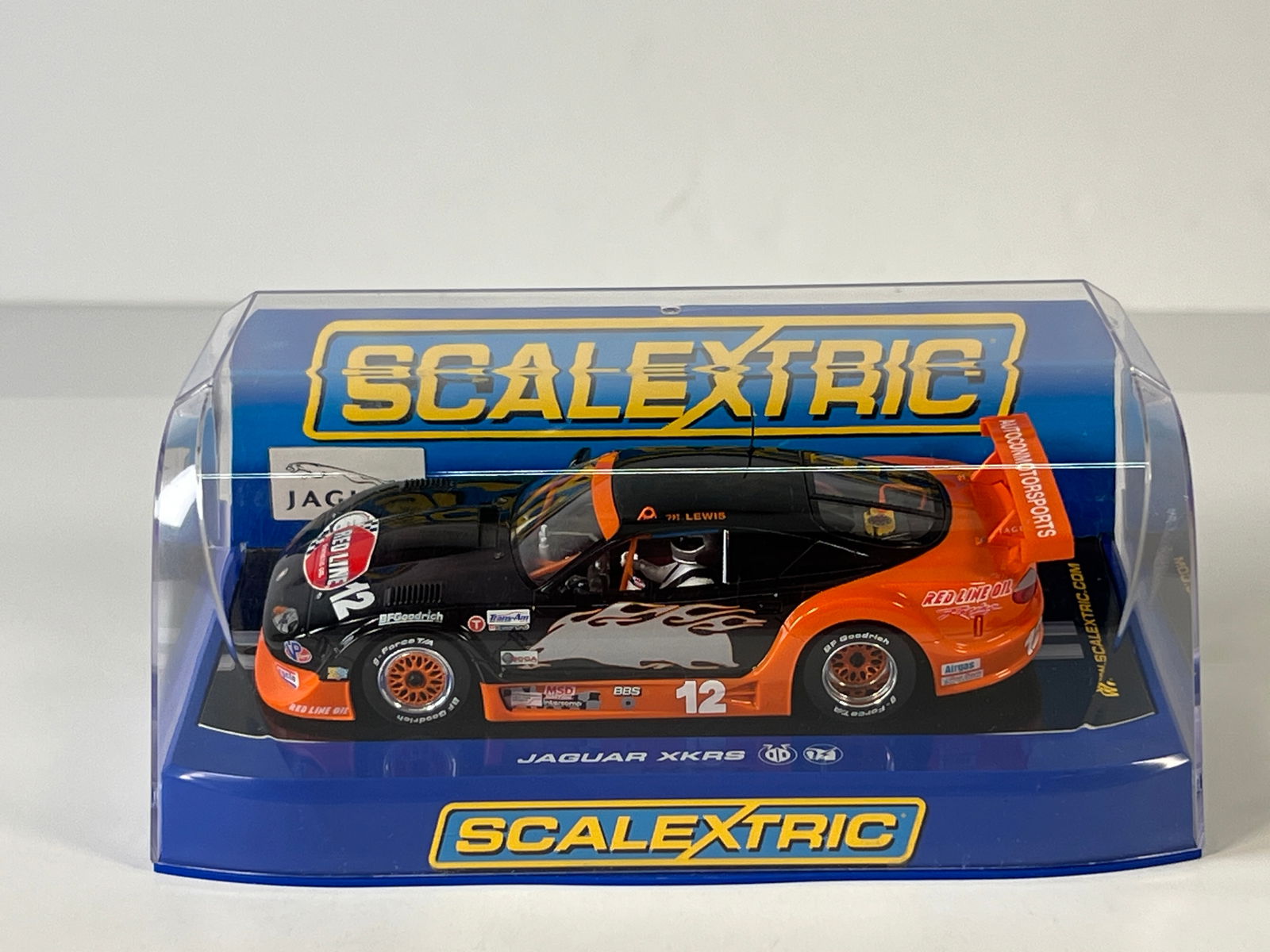 Scalextric Jaguar XKRS #12: Scalextric Jaguar XKRS #12 Red Line 1/32 Slot Car. Reference #C2785, with original case. Weight: 9 oz.