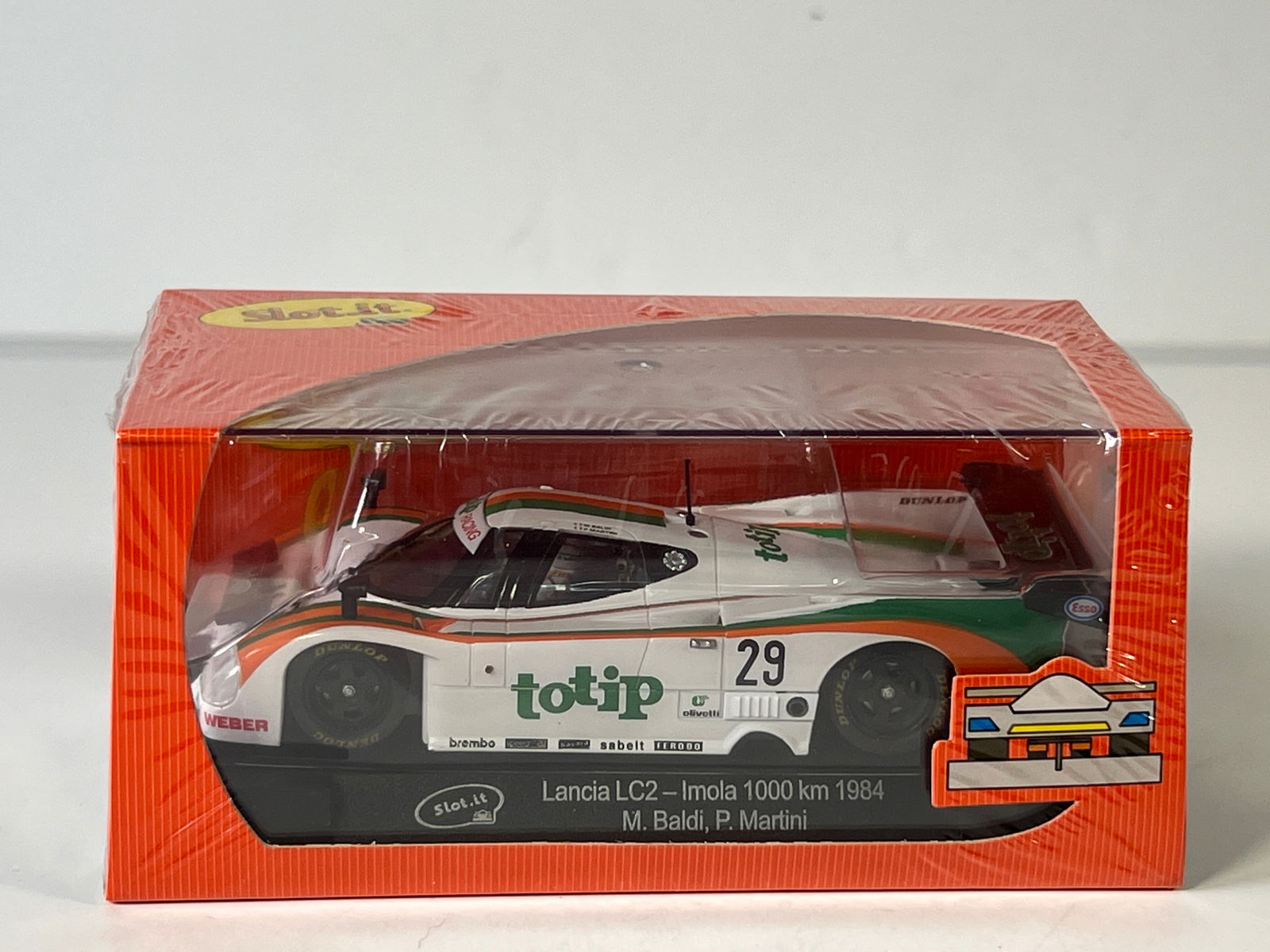 Slot.it Lancia LC2 - Imola 1000 km 1984 #29: Slot.it Lancia LC2 - Imola 1000 km 1984 Baldi - Martini #29 Totip 1/32 Slot Car. Reference #CA08d, with original case. Case length: 6.5 inches. Weight: 7 oz. Shrink-wrapped, new in box.