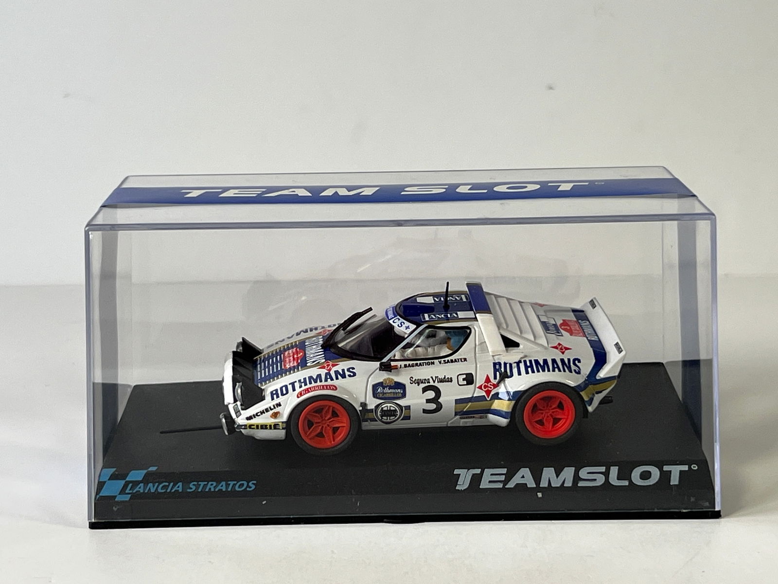 TeamSlot Lancia Stratos Catalunya '76 Rothmans #3: TeamSlot Lancia Stratos Catalunya '76 Rothmans #3 1/32 Slot Car. Reference #11507, with original case. Weight: 7 oz.