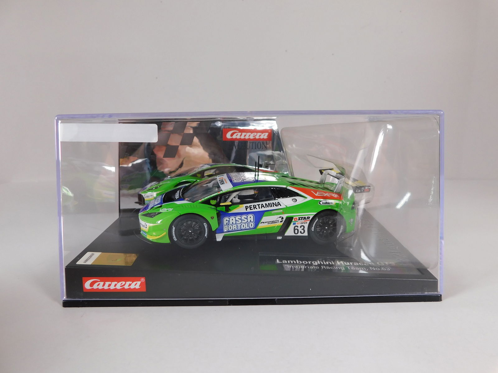 Carrera Evolution Lamborghini Huracan GT3 #63: Carrera Evolution Lamborghini Huracan GT3 Imperiale Racing Team #63 Fasa Bortolo 1/32 Slot Car, with original case. Weight: 18 oz.