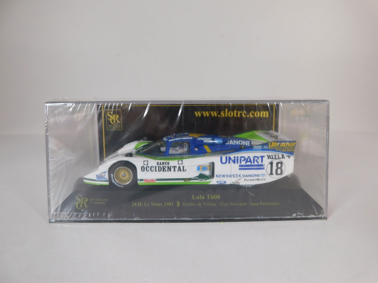 SCR Lola T600 24h. Le Mans 1981 #18: SCR Lola T600 24h. Le Mans 1981 Villota - Edwards - Fernandez #18 Unipart 1/32 Slot Car. Reference #01701, with original case. Weight: 7.6 oz. Shrink-wrapped - new in box.