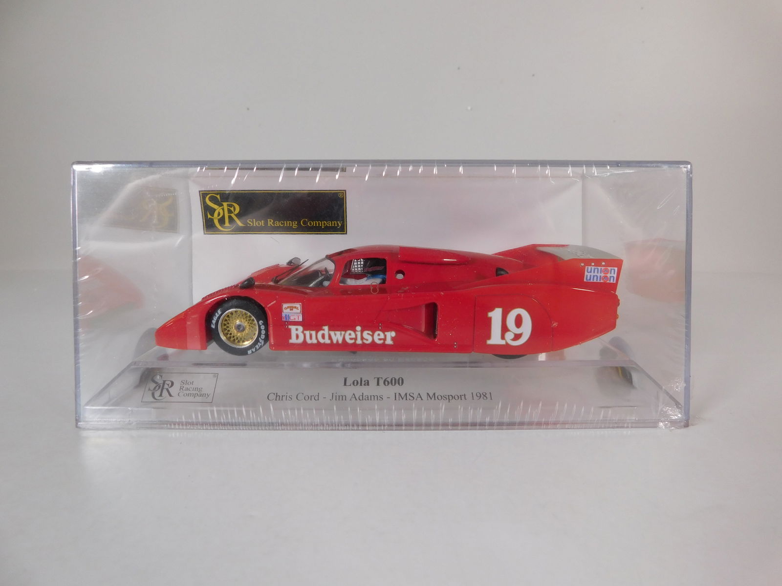 Slot Racing Company Lola T600 Mosport 1981 #19: Slot Racing Company Lola T600 Cord - Adams Mosport 1981 #19 Budweiser 1/32 Slot Car. Reference #01711, with original case. Weight: 7.4 oz.
