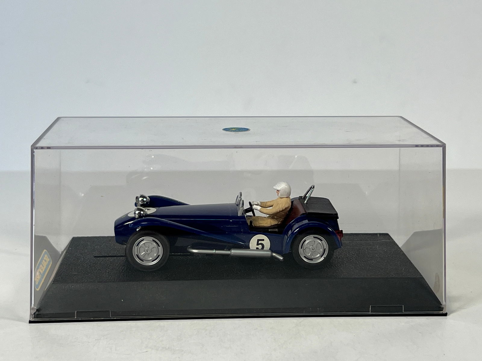 Scalextric Lotus Super Seven Slot Car: Scalextric Lotus Super Seven slot car, number 5, in display case. 