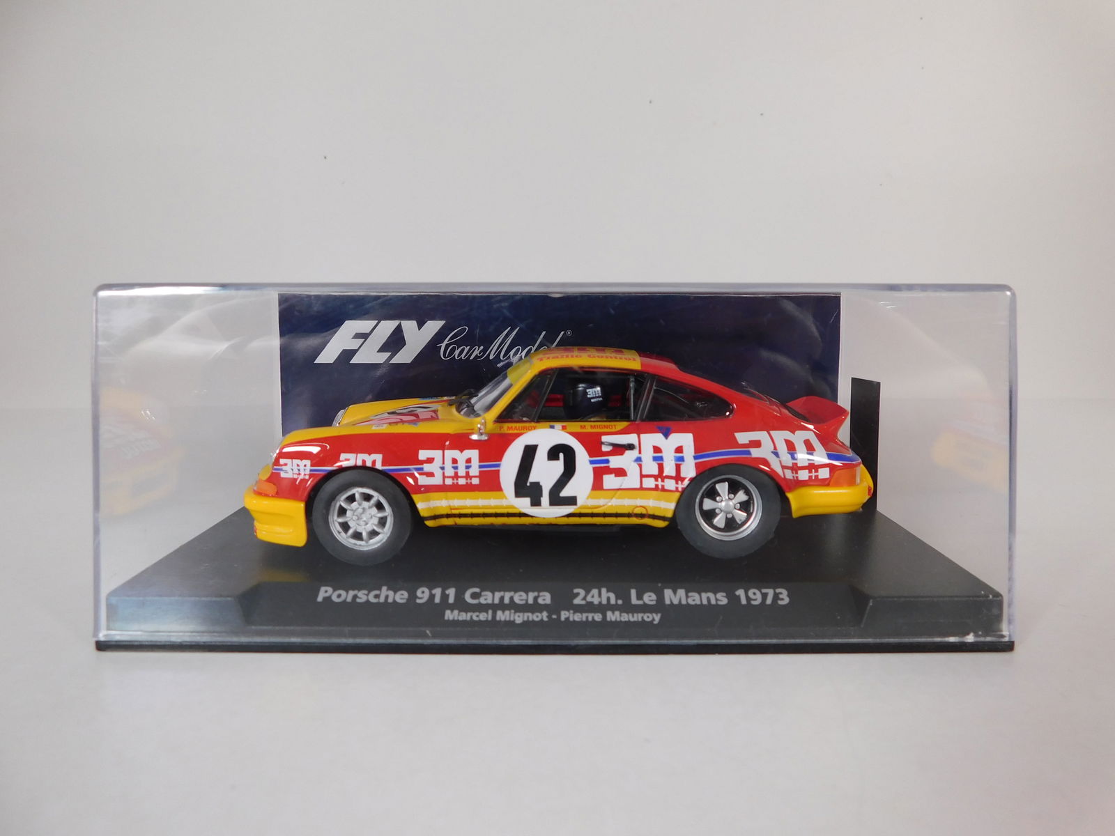 Fly Car Model Porsche 911 Carrera 24h Le Mans 1973 #42: Fly Car Model Porsche 911 Carrera 24h Le Mans 1973 Marcel Mignot - Pierre Mauroy #42 3M Motul 1/32 Slot Car. Reference #88156, with original case. Weight: 6.4 oz.
