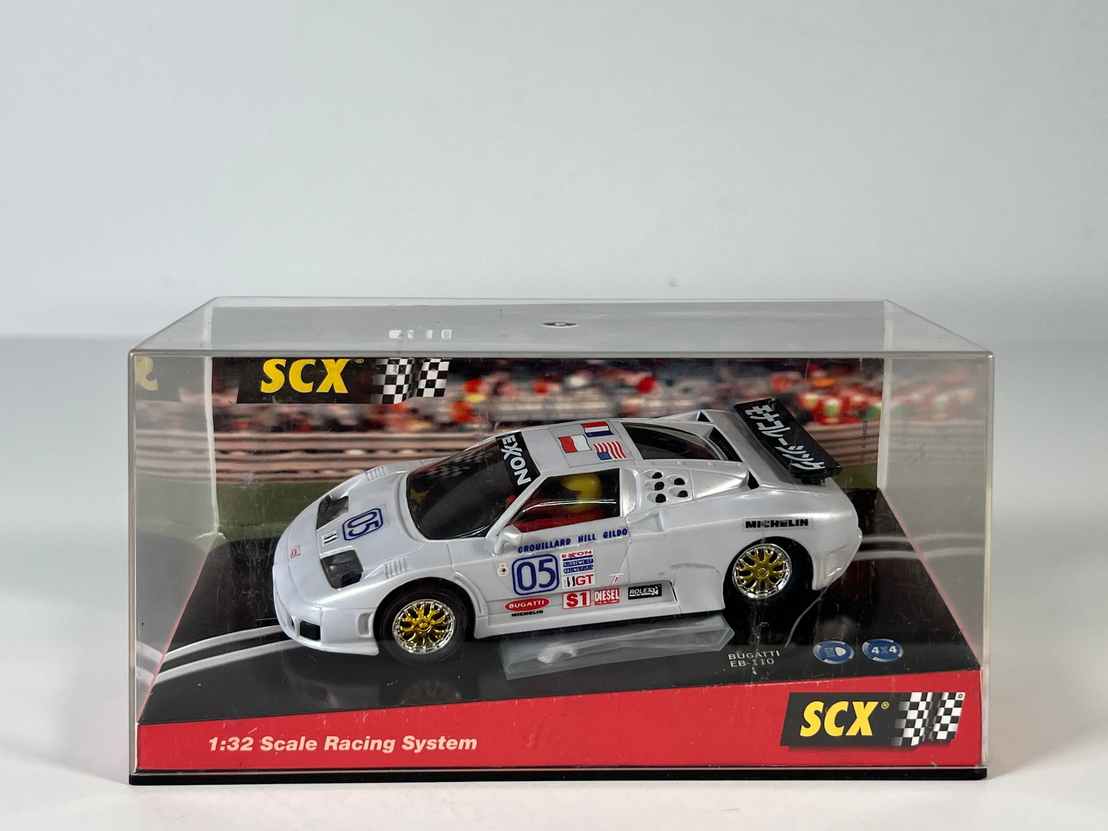 SCX Bugatti EB-110 IMSA #05: SCX Bugatti EB-110 IMSA #05 Exon 1/32 Slot Car. Reference #83210, with original case. Case measures 7.25 inches in length. Weight: 9.2 oz.