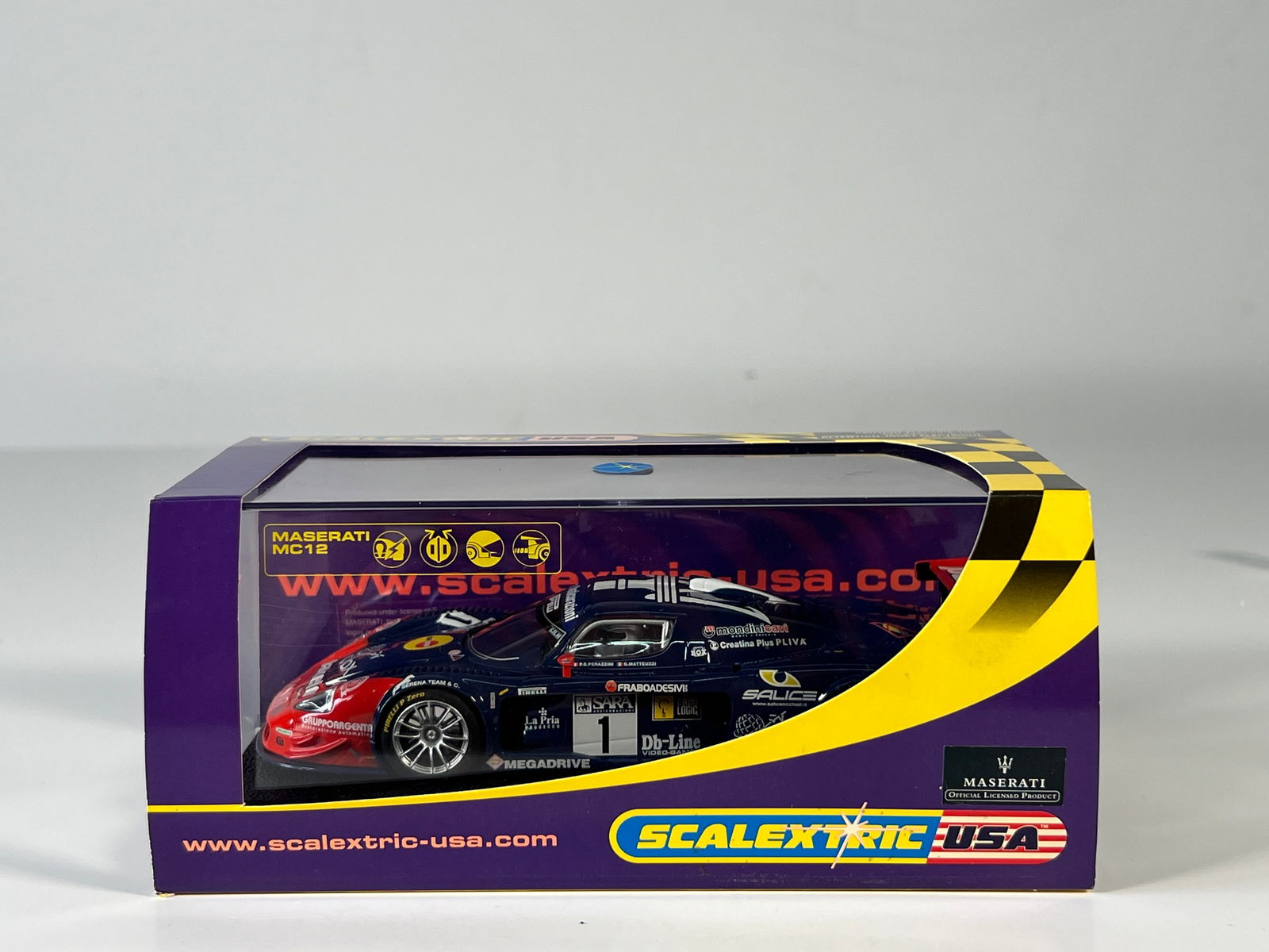 Scalextric USA Maserati MC12 #1: Scalextric USA Maserati MC12 #1 Pakelo 1/32 Slot Car, with original case. Weight: 8.3 oz.