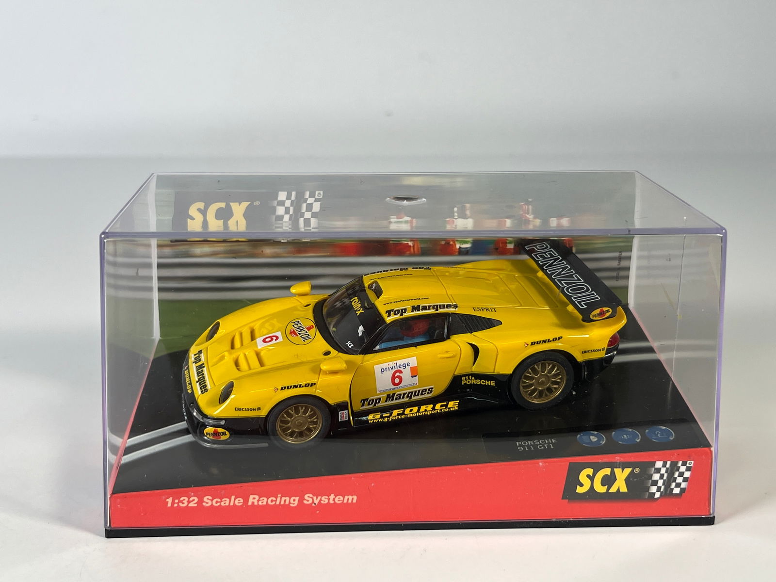 SCX Porsche 911 GT1 Pennzoil #6: SCX Porsche 911 GT1 Pennzoil #6 Top Marques 1/32 Slot Car. Reference #60150, with original case. Weight: 9.7 oz.