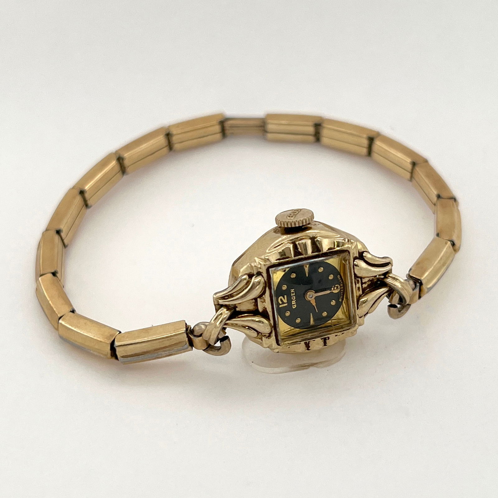 Vintage Gruen Precision Women's Wristwatch 10k Gold: Vintage Gruen Precision women's wristwatch. Features a 10k gold case and band with a black dial. The 17j Gruen 215 movement was crafted in Switzerland with precision and attention to detail, and