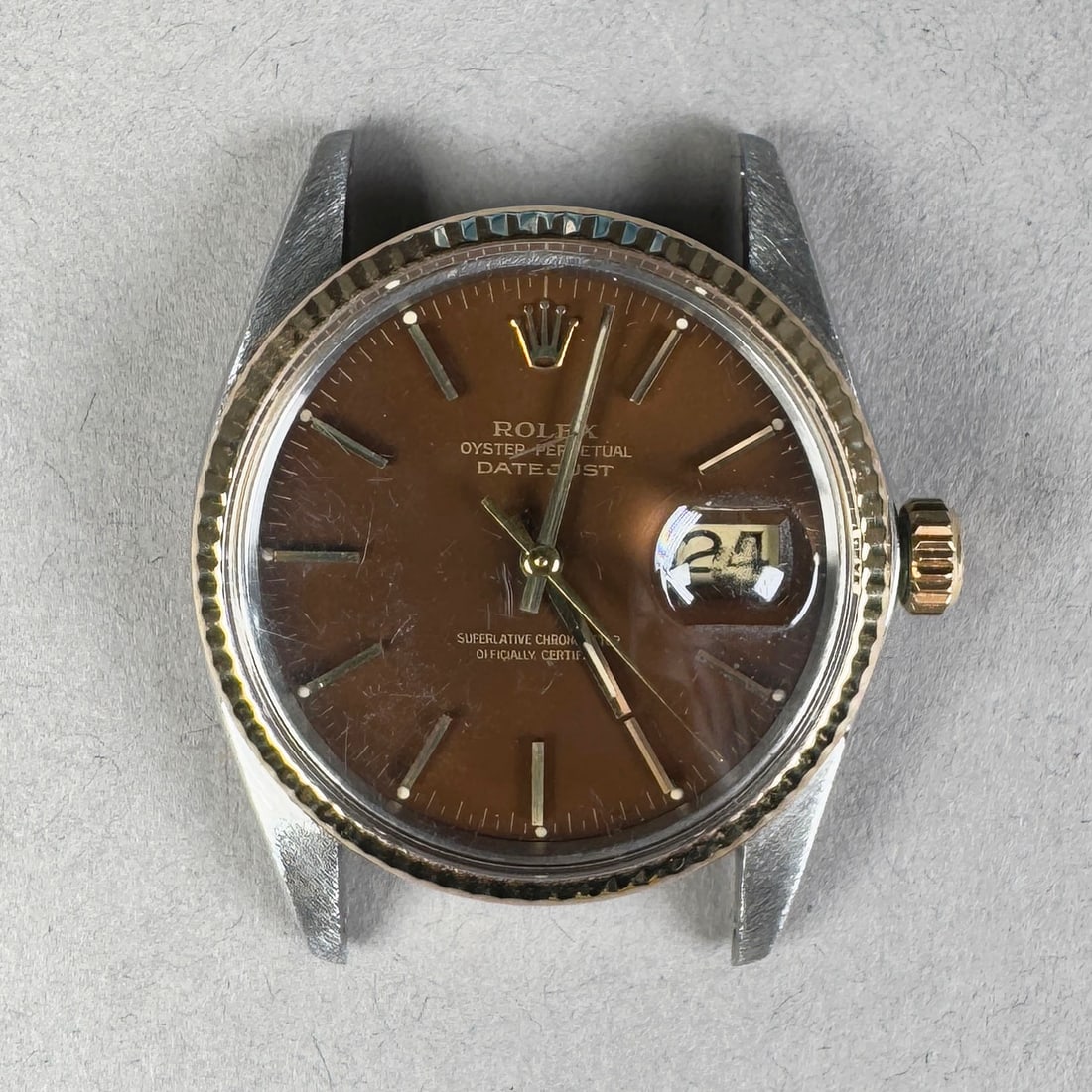 Rolex Oyster Perpetual Datejust 26 Ref. 16013 Two-Tone Watch: Rolex Oyster Perpetual Datejust 36 Ref 16013. Features a two-tone stainless steel and gold case with a brown dial and date window. Includes the original two-tone Jubilee bracelet and is powered by a