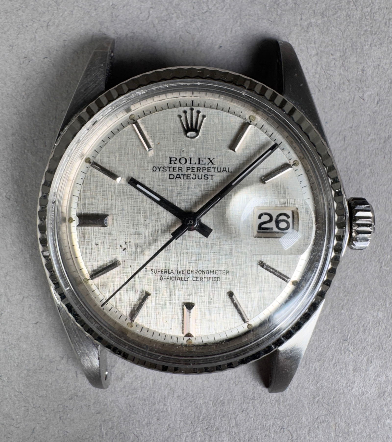 Rolex Oyster Perpetual Datejust 36mm Ref 1601: Rolex Oyster Perpetual Datejust 36mm, Ref. 1601. Features a silver linen dial, date display, stainless steel case, and a 18k fluted bezel. Includes Rolex bracelet. Movement visible. Serial