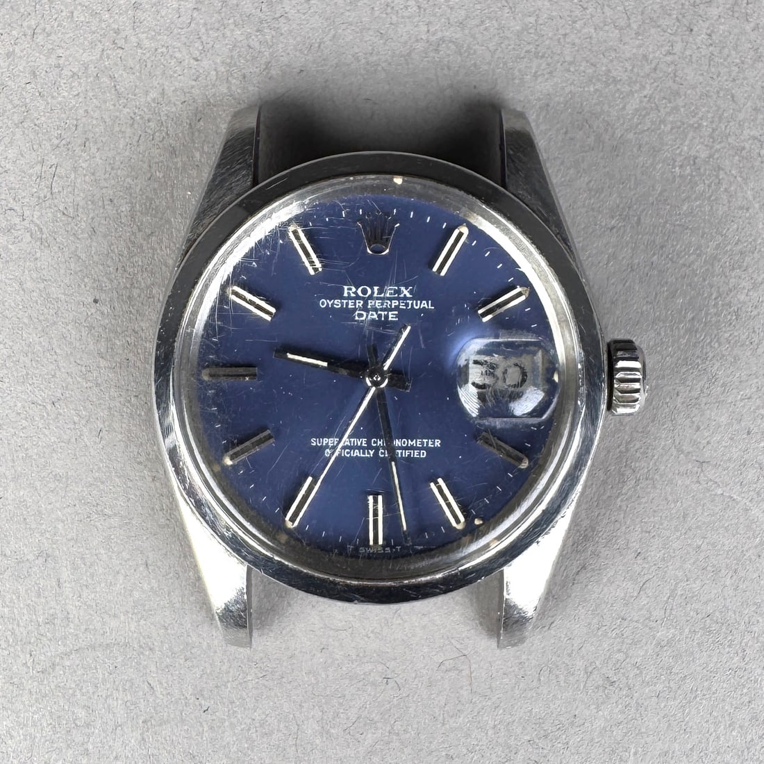 Rolex Oyster Perpetual Date Ref 1500 Stainless Steel Watch: Rolex Oyster Perpetual Date, reference 1500. Stainless steel case with a blue dial and date window. Automatic movement. Serial number 5577353 circa 1978. Case number 0084853. 