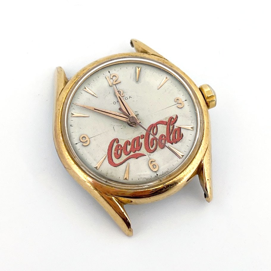 Vintage Omega Coca-Cola Manual Wind Watch, Serial 15090240: Vintage Omega manual wind watch featuring a rare Coca-Cola co-branded dial. It has a gold-tone case and is powered by the rare Omega 420. This manual-wind watch movement was known for its accura
