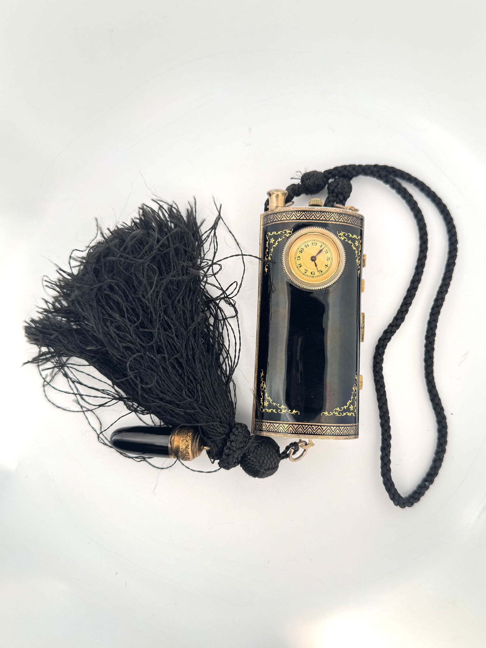 Austrian Sterling Silver 935 Ladies Compact with Watch and Tassel: Ladies Austrian sterling silver 935 compact with a watch, tassel, and cord. Marked 'Sterling 935 Austria 2676'. Measures approximately 4" x 1" (compact) and 18" (cord).
