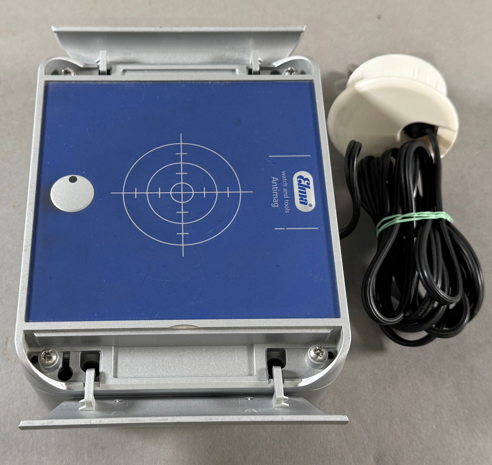 Elma Antimag Demagnetizer: Elma Antimag watch push button instant demagnetizer. Measures approximately 2.5 x 6 inches and weighs 38.7 oz. Includes power cord.