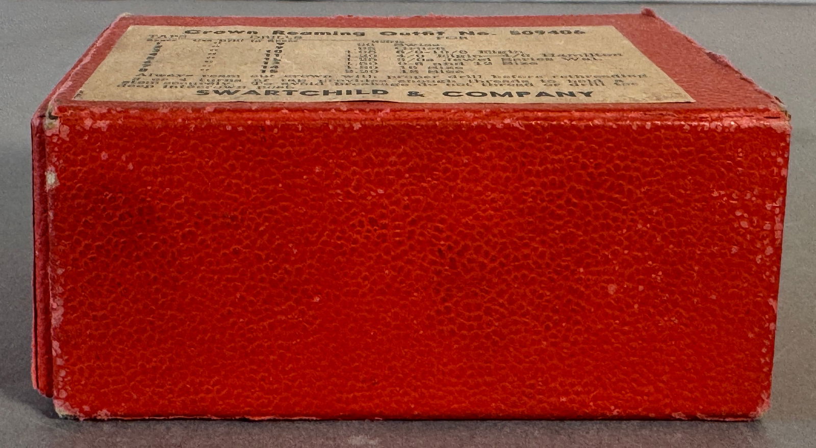 Swartchild & Co. Crown Reaming Outfit No. 509406: Vintage Crown Reaming Outfit No. 509406 by Swartchild & Company. Includes reamer and various sized drill bits in the original red box. Box measures 2 x 4.25 inches.