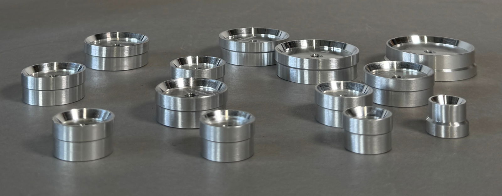 Bergeon 5500-J Reversible Watch Crystal Die Set: Bergeon 5900-J assortment of 13 tapered reversible aluminum stakes. Total weight with the box is 12.6 oz. They have a 5mm mounting hole and fit the Bergeon 5500 case press. Sizes