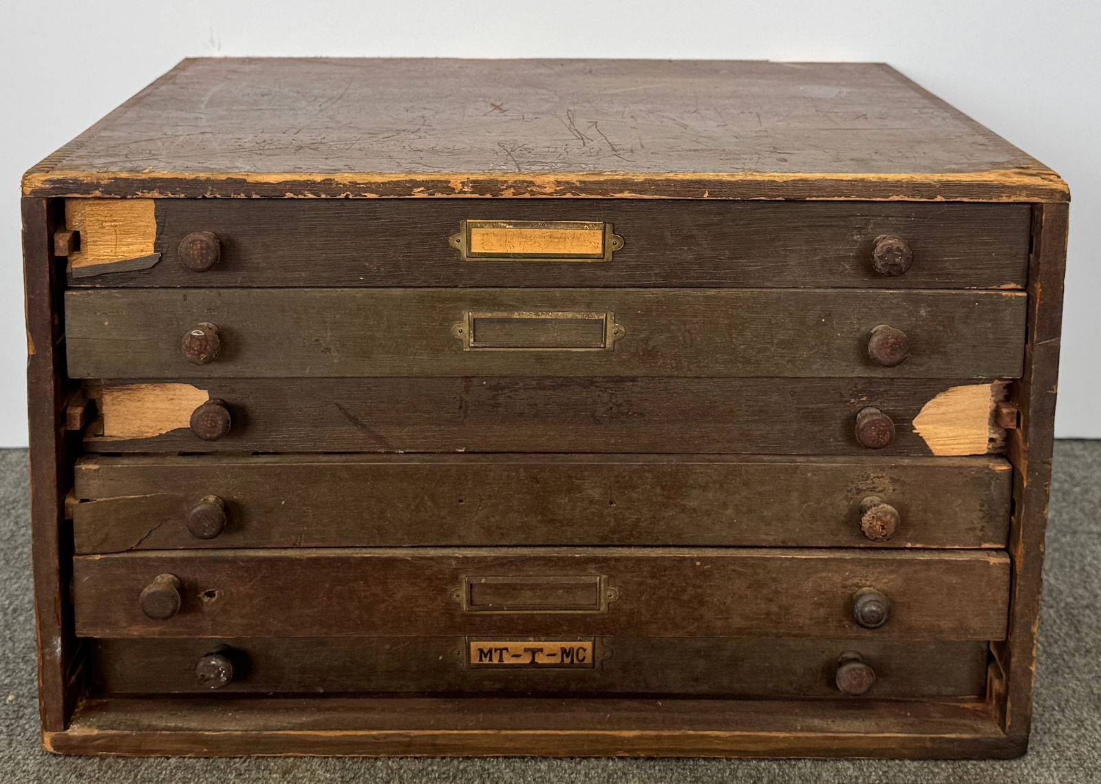 Vintage Wooden Six-Drawer Chest with Circular Pocket Watch Crystals: Vintage wooden chest with six drawers. Each drawer has a knob and a label holder. Some of the drawer slots have circular or oval pocket watch crystal. Measures approximately 11 x 18.5 inches.