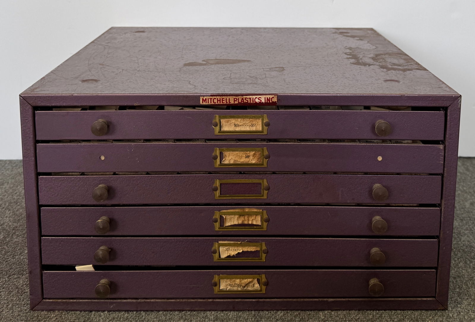 Vintage Six-Drawer Cabinet with Rectangular (irregular) Wristwatch Crystals: Vintage six-drawer cabinet with various rectangular wrist watch crystals. Some of them are irregular, consistent with the art deco case shapes. Marked with various brands including Longines, Elgi