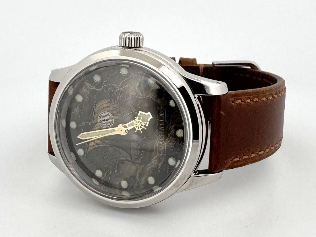 Valhalla by SHM Creations: The Valhalla is a custom art design cut into brass a dial and hand painted. Housed in a stainless steel case rated for 200m, it is powered by a Seiko automatic movement and has a new leather