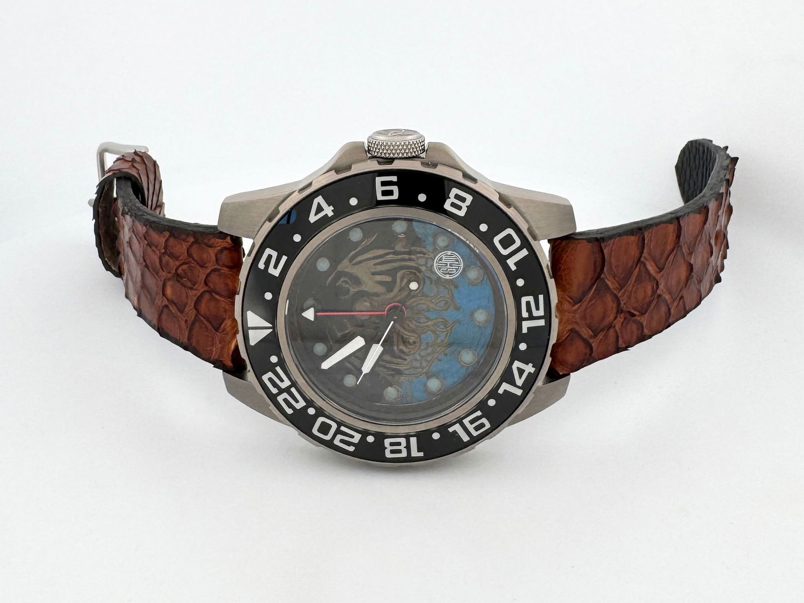 Blue Cthulhu by SHM Creations: The custom Cthulhu brass dial is hand painted to invoke the style and spirit of the novel that inspires it. It is housed in a 50mm titanium case with sapphire crystal on front and on the exhibition