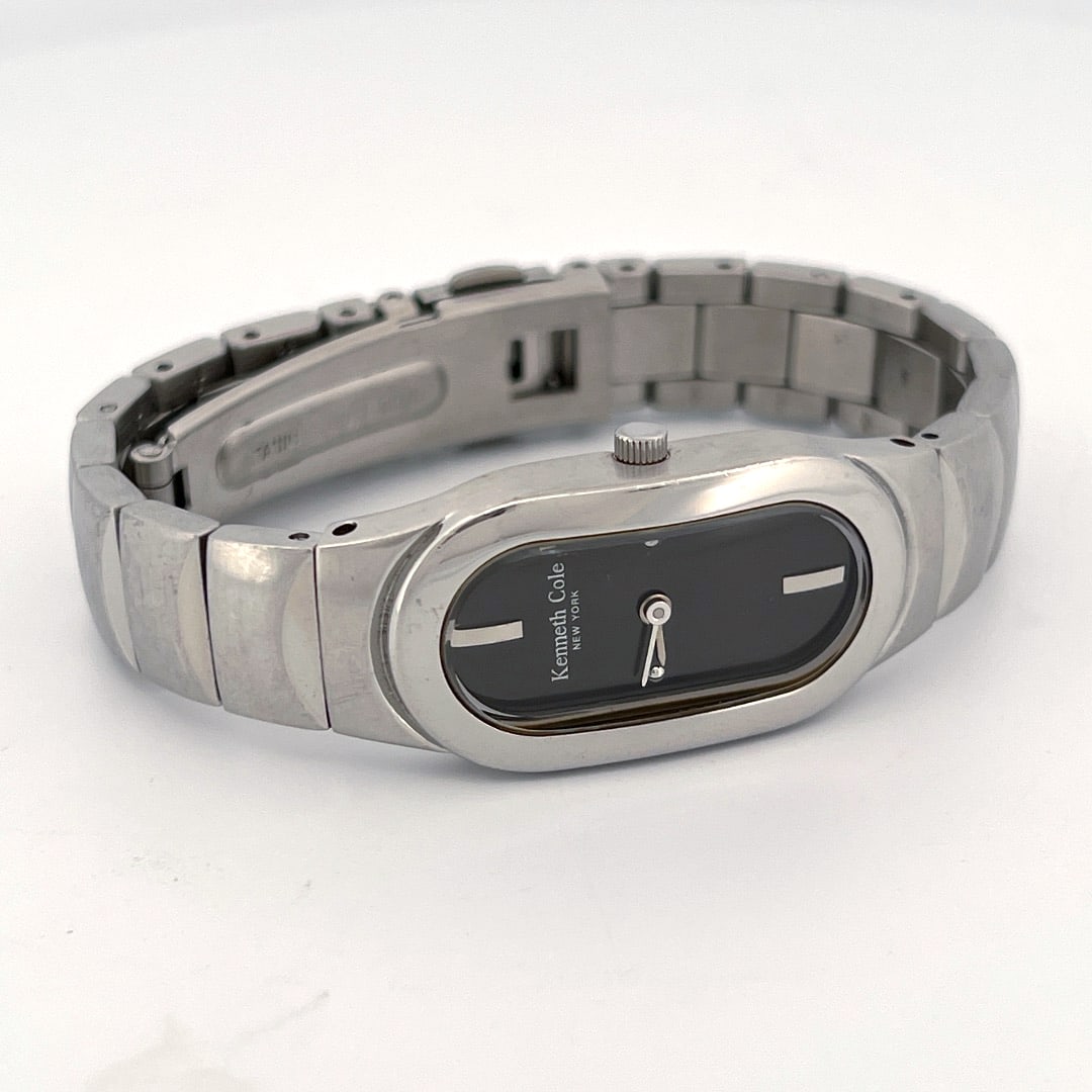 Kenneth Cole Ladies' Stainless Steel Quartz Wristwatch - KC4308: Ladies' Kenneth Cole wristwatch with a stainless steel band and case. The watch features a black dial with minimalist hour markers. Japan movement. Battery SR621SW. Model 9275-02-K04306.