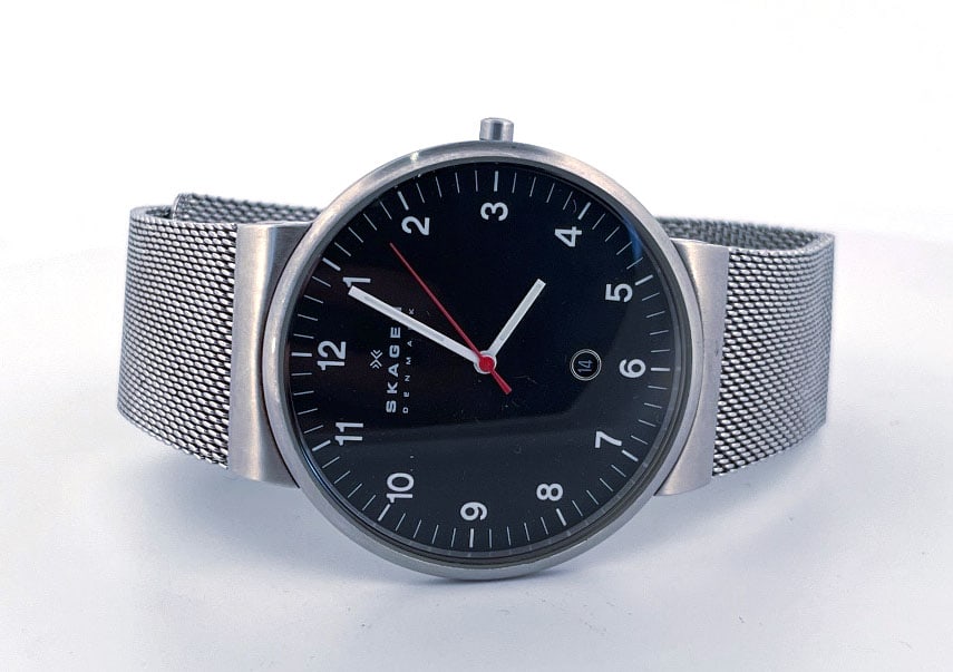 Skagen Denmark SKW6051 Wristwatch: Skagen Denmark wristwatch, model SKW6051. Features a black dial with silver-tone hands and markers, and a stainless steel mesh band. Water resistant.