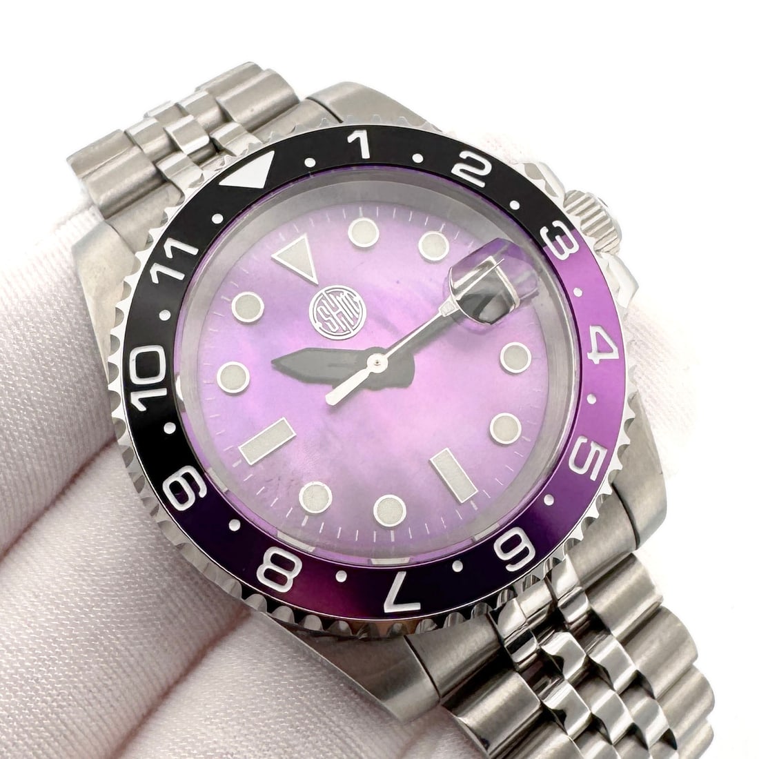 Velvet Equinox by SHM Creations: The Velvet Equinox is a purple sub diver that is centered around a purple mother of pearl dial and accented by the two toned bezel insert. With its sapphire crystal, stainless steel case, and 316L