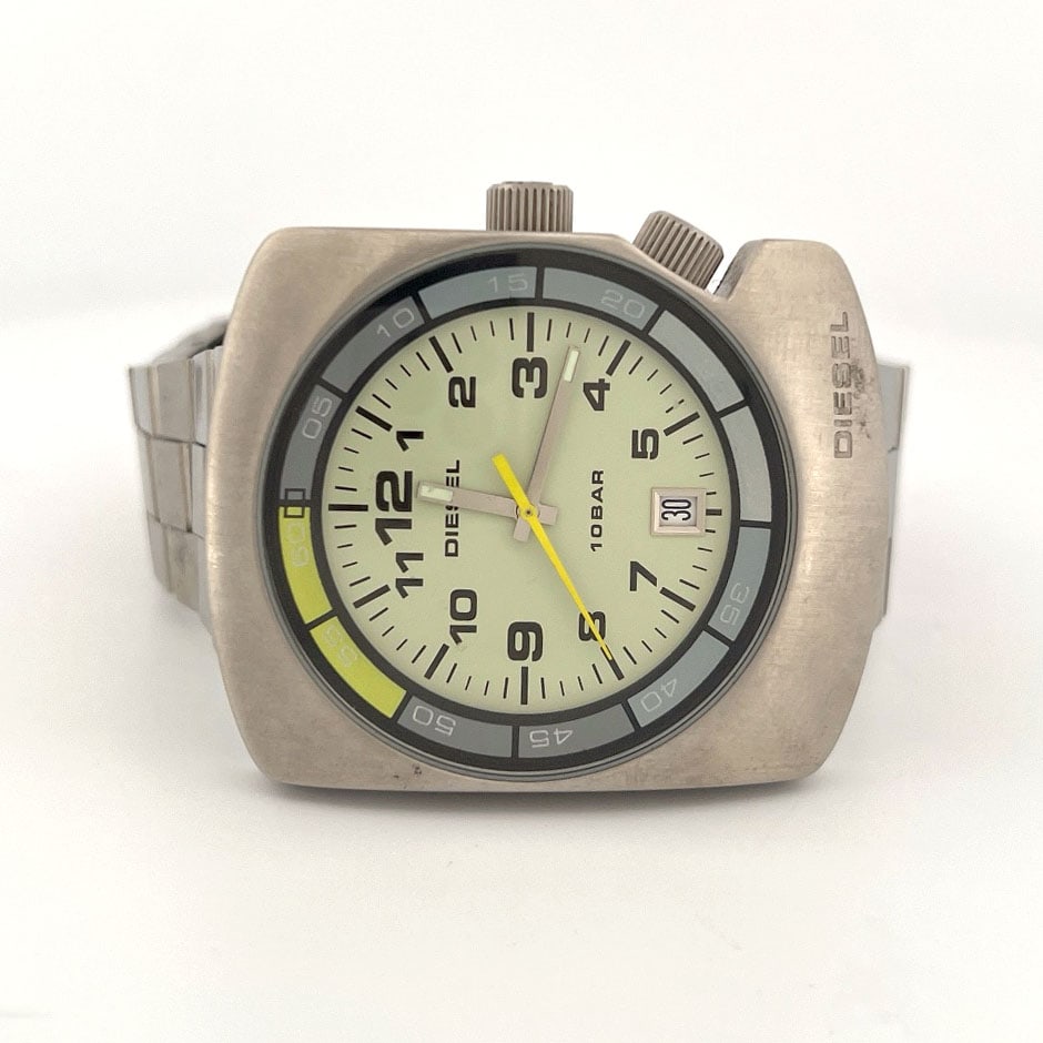 Diesel DZ-2044 Stainless Steel Wristwatch: Diesel wristwatch, model DZ-2044. Features a stainless steel case and band, luminous dial with yellow second hand, and date display. Water resistant to 10 BAR. Quartz movement.
